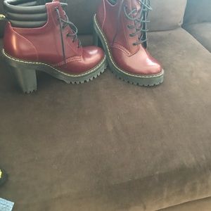 Doctor Martens boots wine color.